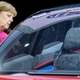 FRANKFURT AM MAIN, GERMANY - SEPTEMBER 14: The German Chancellor Angela Merkel looks into a Volkswagen ID Crozz electric crossover concept car during her visit at the 2017 Frankfurt Auto Show ‘Internationale Automobil Ausstellung’ (IAA) on September 14, 2017 in Frankfurt am Main, Germany. The Frankfurt Auto Show is taking place during a turbulent period for the auto industry. Leading companies have been rocked by the self-inflicted diesel emissions scandal. At the same time the industry is on the verge of a new era as automakers commit themselves more and more to a future that will one day be dominated by electric cars